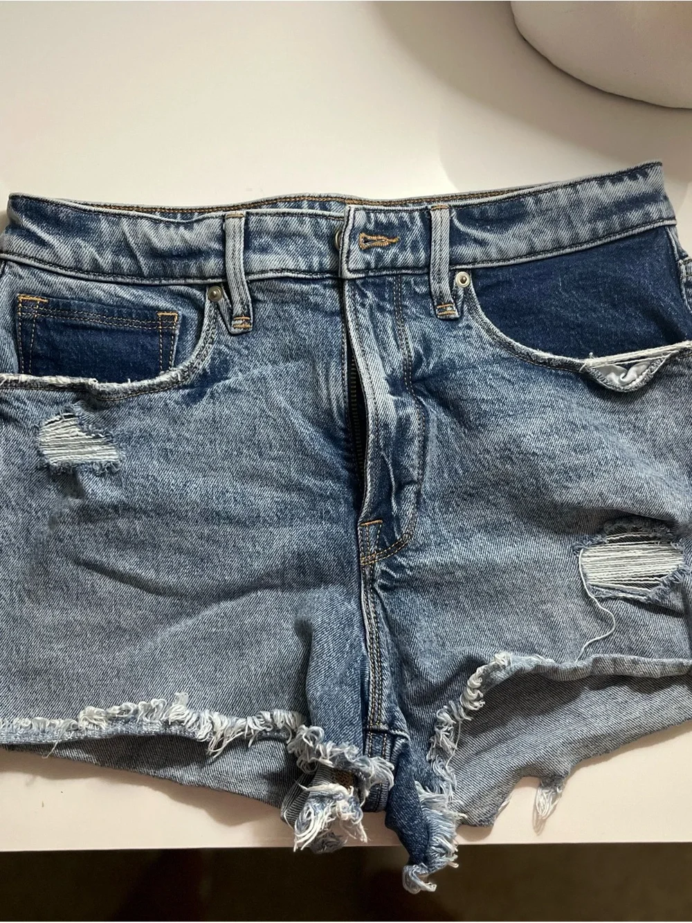 Good American Light Wash Distressed Denim Shorts